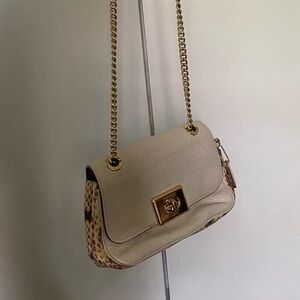 Coach leather bag with brass details and snake like leather